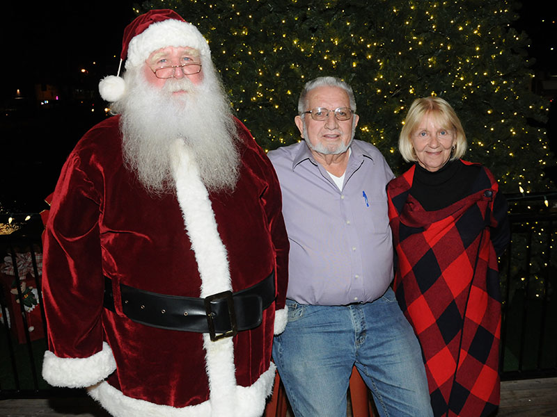 McCaysville Mayor Thomas Seabolt and Ann Williams welcomed Santa Claus to Light Up McCaysville festivities Friday night, November 29. The event included singers and cartoon characters who visited with the many children who attended.