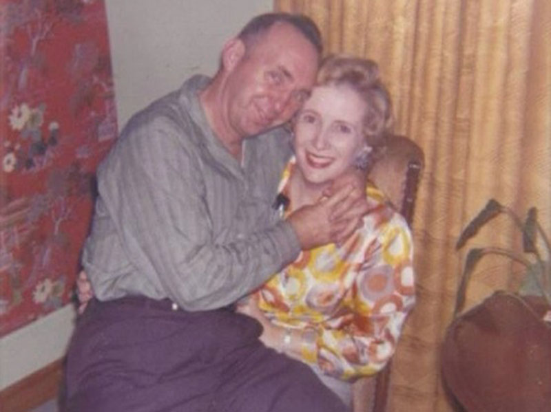 Blue Ridge’s Dale Dyer sits on the lap of his wife, Virginia.