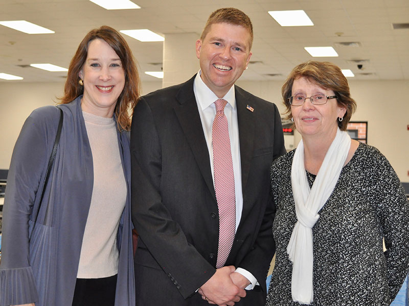 Manda Gwatney, from left, and School Superintendent Dr. Michael Gwatney were among the co-workers and friends who helped Theresa “T.C.” Dillard celebrate her retirement at a December 12 reception.