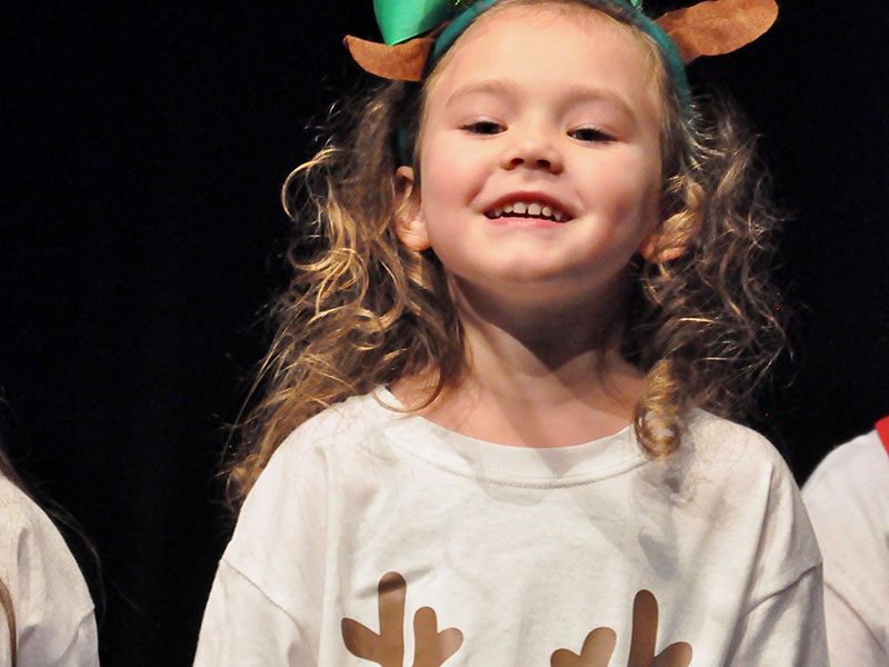 East Fannin Elementary School student Harper Newton excitedly performed the “Reindeer Hokey Pokey” with her fellow classmates during the school’s annual White Christmas program Thursday, December 19.