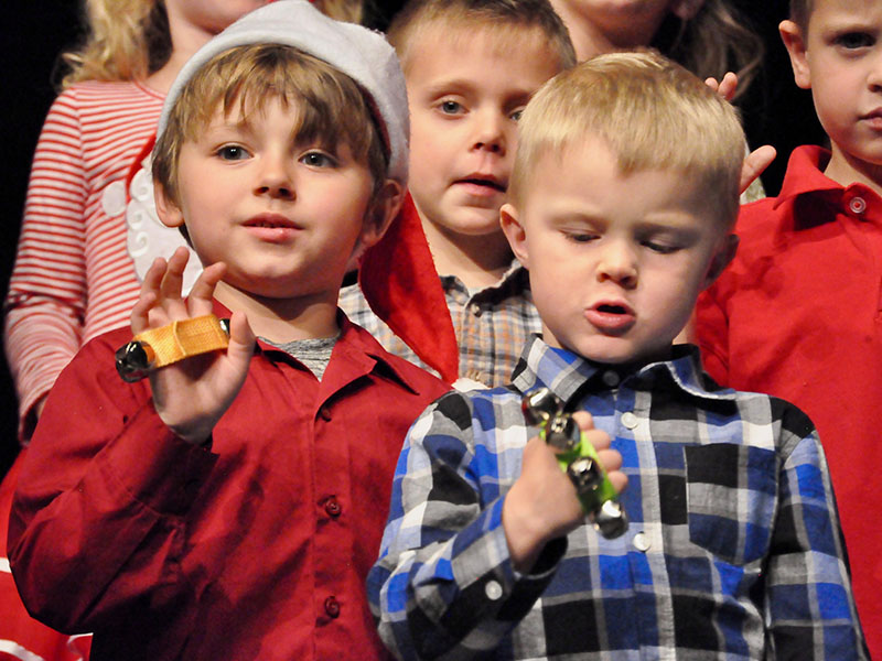 East Fannin Elementary School students Baine Allgary, left, and Landon Satterfield performed a jingle bell song at the school’s annual White Christmas program.