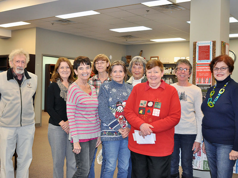 The Friends of the Fannin County Library hosted a Christmas Open House Friday, December 6. Shown are, from left, front, Walter Scott, Patti Warren, Kathy Williams and Heidi Rule; back, Lois Stambaugh, Susan Loring, Sue Cole, Ginny Smith and Hope Burns.