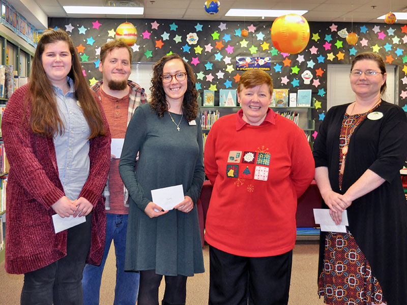 The Friends of the Fannin County Library presented Christmas gifts to the library’s staff during their Christmas Open House. Shown are, from left, Catherine Barr, Mike Lavery, Emily Cannaverde, Vanessa Pittman and Heidi Rule.