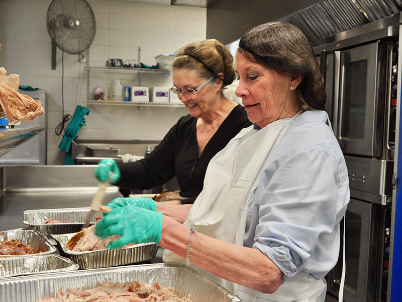 Barbara Davenport, front, and Mary Harmstom volunteered their time to prepare traditional Thanksgiving meals for The Good Samaritans of Fannin County’s Community Thanksgiving Open Table event, which took place Thursday, November 28.