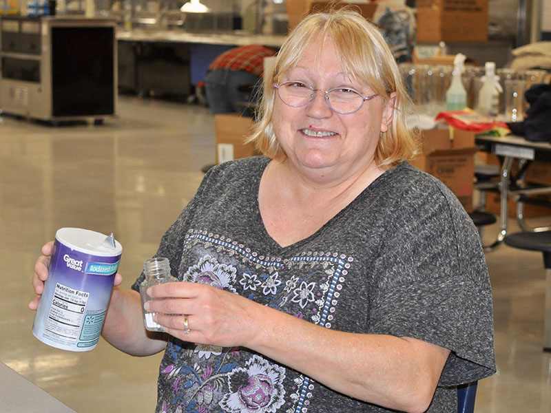 Good Samaritans of Fannin County volunteer Charlotte Gillespie helped prepare for the organization’s Community Thanksgiving Open Table event by filling salt shakers Wednesday, November 27.