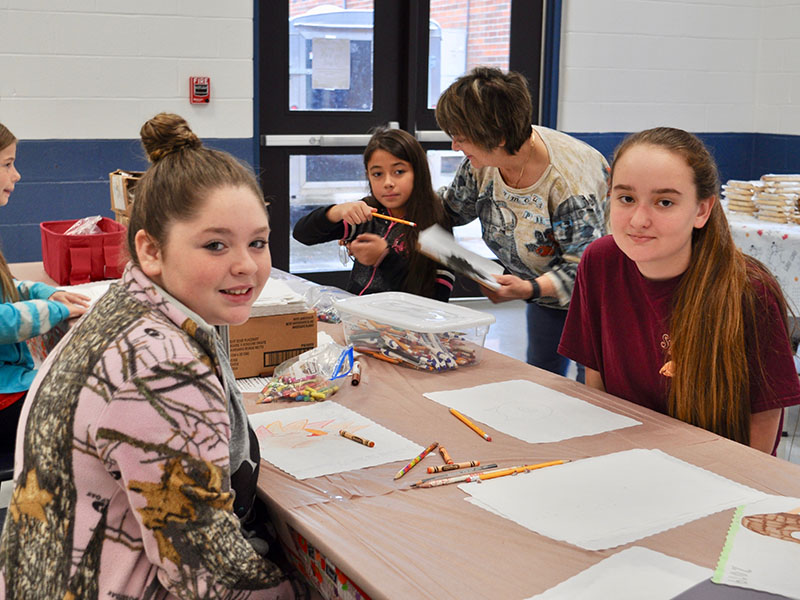 Girl Scouts Alyssa Marshall, left, and Kaleighann Ware created artwork to decorate The Good Samaritans of Fannin County’s Community Thanksgiving Open Table event.