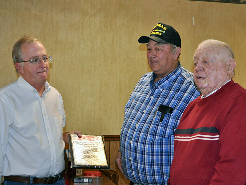 Tri-State EMC’s Operation Roundup, which makes donations to community causes from members rounding up of their electric bills, was honored at the Fannin County veterans organizations’ Christmas dinner for the program’s contribution to the Disabled American Veterans Chapter 28. Operation Roundup Chairman Glenn Harbison, left, accepted the award from Paul Hunter, center, and Joe Brandon.