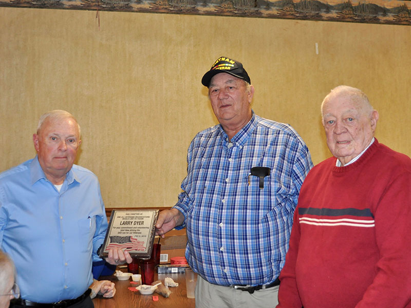 Larry Dyer, left, was honored at the Fannin County veterans organizations’ Christmas dinner Thursday, December 5 for volunteering his time to drive the Disabled American Vets van for community veterans. He is shown with Paul Hunter, right.