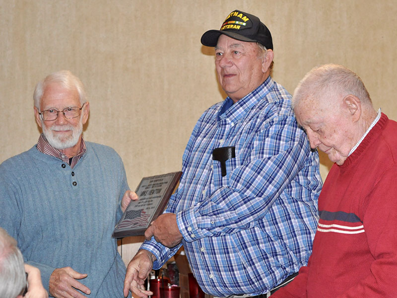 The Fannin County veterans organizations honored Mike Newton, left, and thanked him for driving community veterans to the VA hospital in the Disabled American Veterans van. He is shown with Paul Hunter, middle, and Joe Brandon.