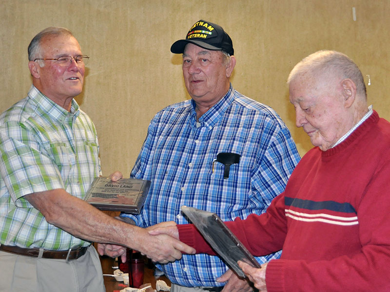 David Land, left, was honored at the Fannin County veterans organizations’ Christmas dinner Thursday, December 5 for volunteering his time to drive the Disabled American Vets van for community veterans. He is shown with Paul Hunter, middle, and Joe Brandon.