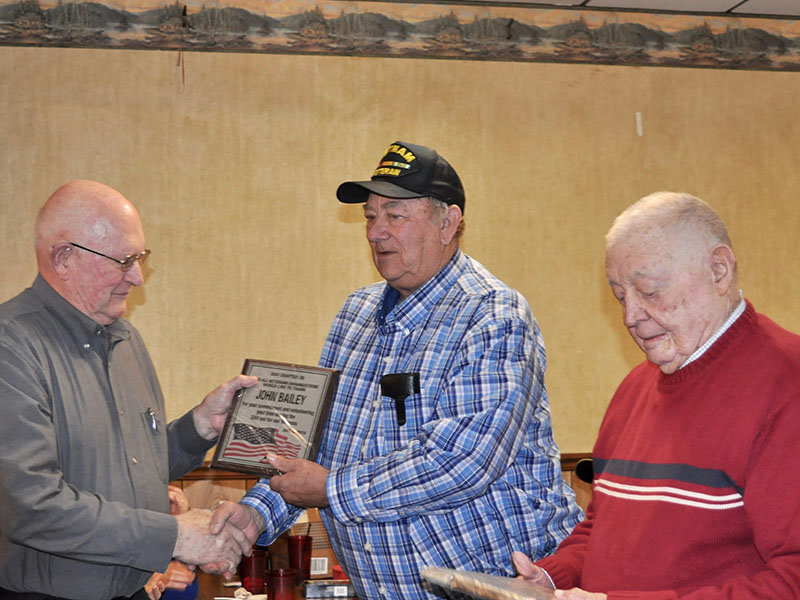 John Bailey was one of eight to be recognized at the Fannin County veterans organizations’ Christmas dinner Thursday, December 5 for volunteering to drive community veterans in the Disabled American Veterans van. He is shown with Paul Hunter, right.