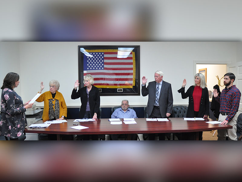 The City of McCaysville held a swearing in ceremony for the newly elected and  re-elected city officials. Shown are, from left, City Clerk Nancy Godfrey, re-elected councilwoman Sue Beaver, new councilwoman Gilita Carter, re-elected Mayor Thomas Seabolt, re-elected councilman Larry Collis, new councilwoman Susan Kiker and new councilman Jason Woody.