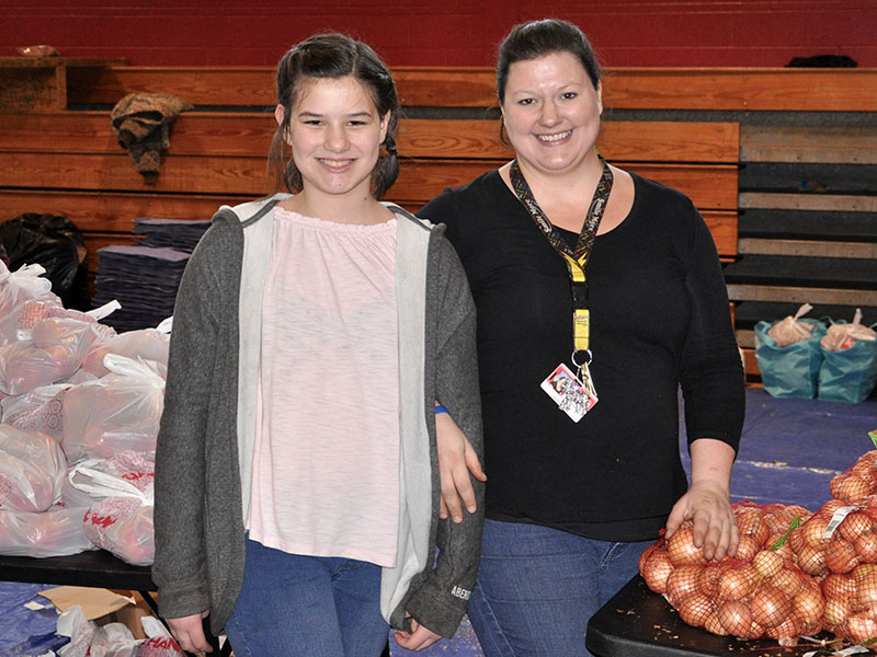 Copper Basin Elementary School allows community members to come and receive free groceries at their monthly food bank. Raegan, left, and Sarah Garner were among the many smiling faces to serve the Copper Basin Community Thursday, January 16.