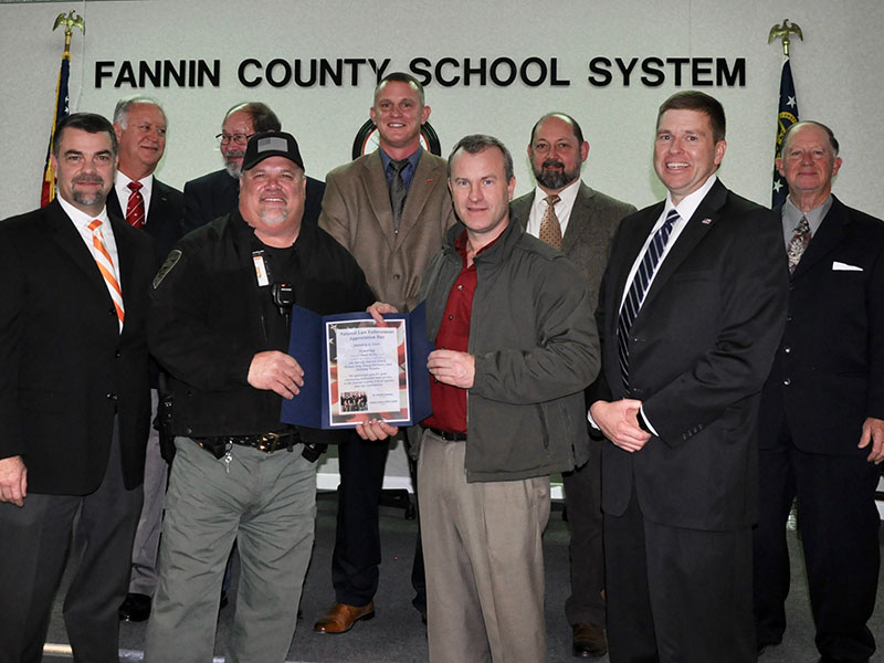 The Fannin County Board of Education recognized local law enforcement’s hard work and dedication to Fannin County schools for National Law Enforcement Appreciation Day Thursday, Janaury 9. Shown are, from left, front, Assistant Superintendent Darren Danner, School Resource Officer Tracy Summers, Sherriff Dane Kirby and Superintendent Dr. Michael Gwatney; back, board members Terry Bramlett, Lewis DeWesse, Chad Galloway, Mike Cole and Bobby Bearden.