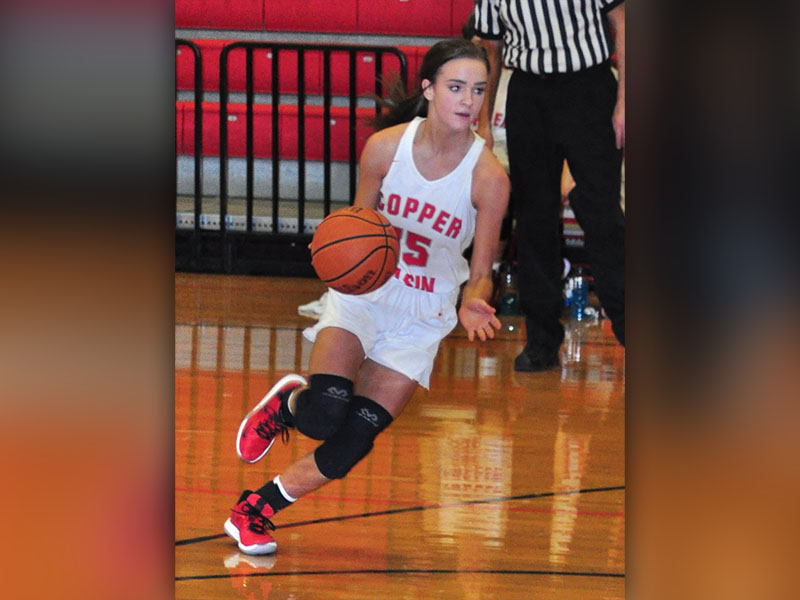 Lady Cougar Riley Smith drives toward the basket in recent action for Copper Basin.