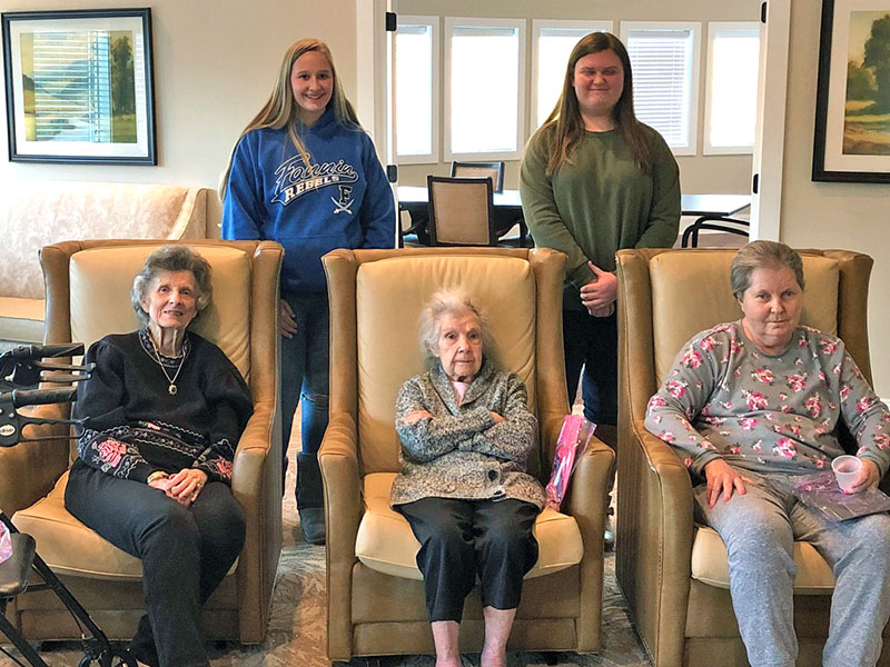 Fannin County High School students, Anna Rhodes and Gracie Stewart, performed research about the positive impact that music therapy has on the elderly population. Shown with the residents at Blue Ridge Assisted Living and Memory care are, from left, front, Georganna Johnson, Alice Lundgren and Brenda Johnson; back, Rhodes and Stewart.   