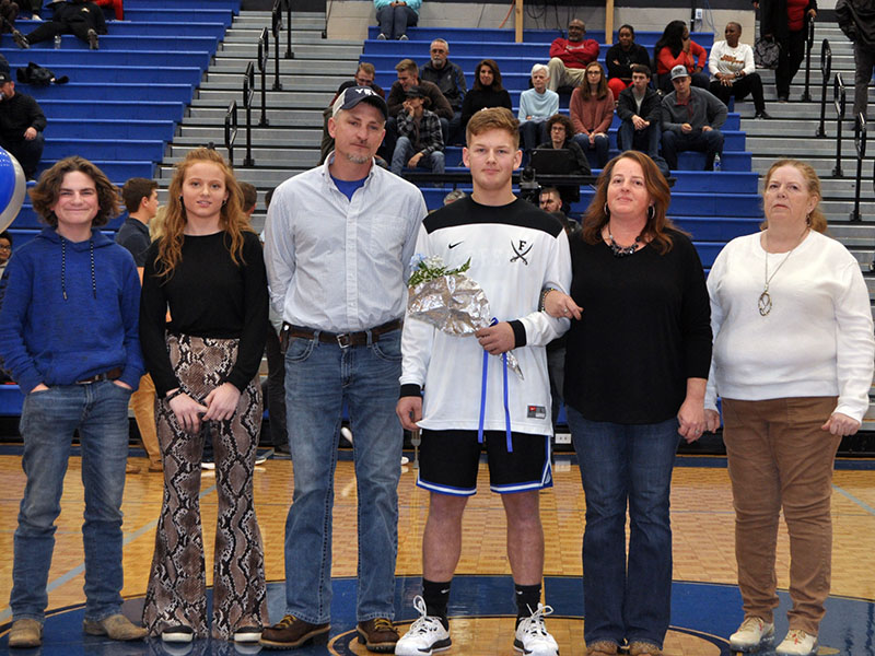 Eight Fannin County seniors were honored Friday, January 31, at Fannin County’s home basketball game against GAC. Shown are, from left, Wyatt Crawford, brother; Jayden Holloway, sister; Andy Crawford, step father; senior Jerritt Holloway, Carrie Crawford, mother; and Annette Wilson, grandmother.