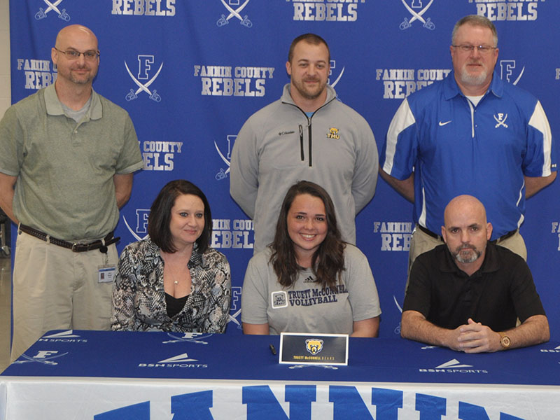 Lady Rebel Haley Parks chose to further her academic and volleyball career by signing a scholarship to go to Truett McConnell University Monday, February 3. Shown are, from left, front, Carie Lindsey, stepmother; Parks, Garrick Parks, father; and back, Fannin County head volleyball coach Jason Stanley, Truett McConnell volleyball head coach Mark Corbin, Fannin County junior varsity volleyball coach and varsity assistant Joe Breeden.