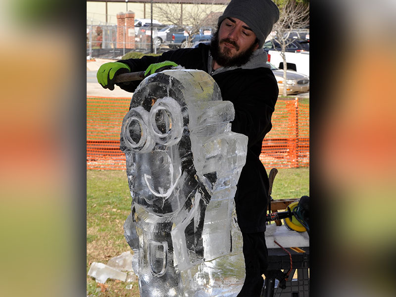 Rock on Ice sculptor Mike Banner chipped away at a block of ice, creating a “Despicable Me” minion, during Blue Ridge’s Fire & Ice Chili Cook-Off and Craft Beer Festival Saturday.