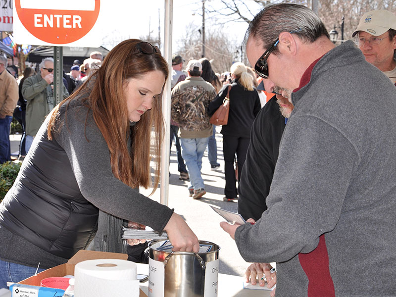 Erica Shirbroun gets a chili card for a patron during the weekend’s festival in downtown Blue Ridge.