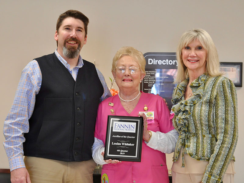 Louiza Whitaker, middle, was named Auxilian of the Quarter at Fannin Regional Hospital Auxiliary’s first quarterly meeting of the year. She is shown with Fannin Regional Hospital CEO Jason Jones and Director of Volunteer Services Susan Kiker.
