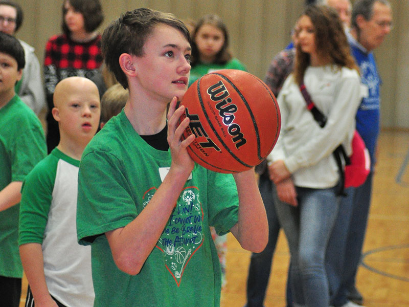 Matthew Marlowe sizes up the basket for a shot during Fannin County Special Olympics basketball competition at the Fannin County Recreation Center Friday, January 31.