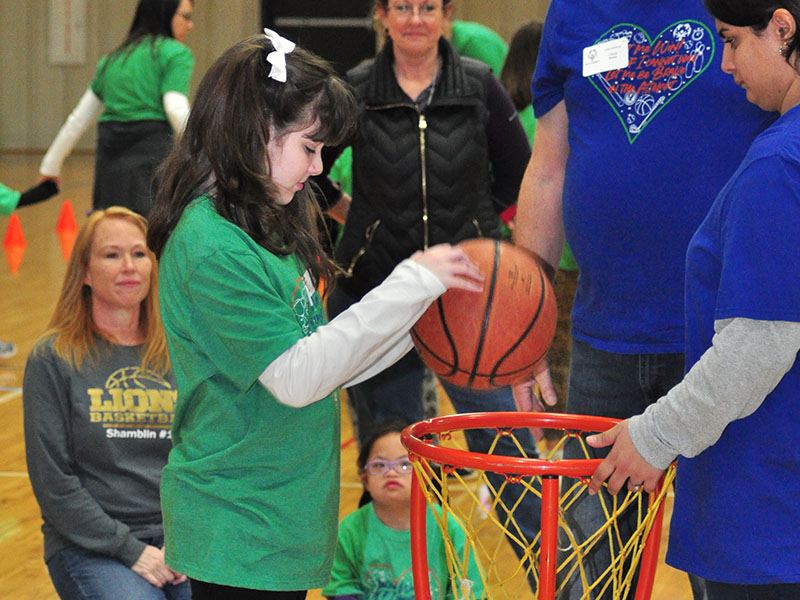 Autumn Hughes sinks a basket during the Fannin County Special Olympics basketball competition Friday, January 31, at the Fannin County Recreation Center.