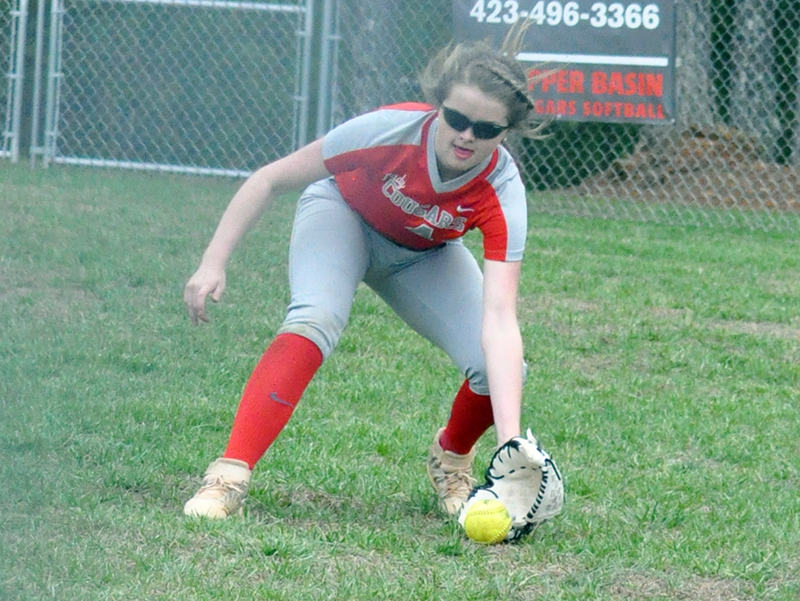 Lady Cougar Haley Harper scoops up a ground ball during the Lady Cougars first game of the season Monday, March 9.