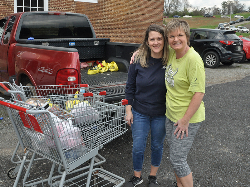 Wendy Bradburn, left, and Angela Deal pitched in to do their part at the Hoist House.