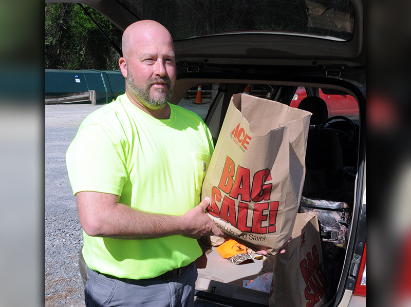 We Are Polk County volunteer Robby Hatcher was at the Polk County Convenience Center in Grassy Creek Saturday passing out bags of groceries to anyone in need.