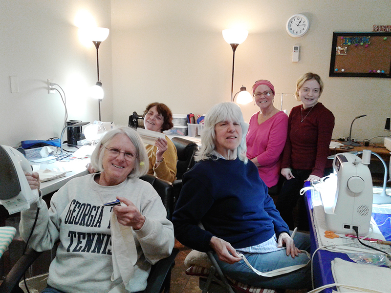 The Blue Ridge Community Theater “Costume Ladies” took initiative in sewing together masks to supplement the demand of N95 masks which deter airborne COVID-19 Monday, March 23. Helpers shown, from left, are Sue Hoagland, Pam Wilson, Deb Chavez, Renee Roberts and Olivia DeLoy.