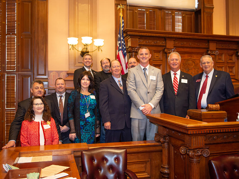 Members of the Fannin County Board of Education and school district leadership attended a legislative site visit day under the gold dome at Georgia’s capitol, where they were recognized in the House of Representatives by Speaker David Ralston Tuesday, February 3. Shown are, from left, front, board attorney Lynn Doss, Director of Achievement Sarah Rigdon, board members Bobby Bearden, Chad Galloway and Terry Bramlett, and Ralston; back, State Senator Steve Gooch, Assistant Superintendent Robert Ensley, Superi