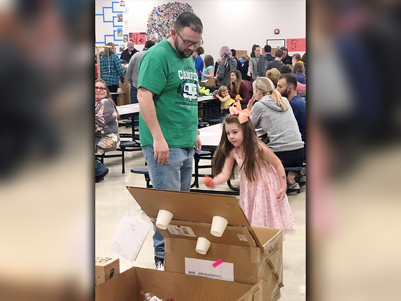 Blue Ridge Elementary School student Chloe Wishart and her father, Kevin Wishart, tested an arcade game that was built during STEAM classes and presented during the school’s annual STEAM Night Tuesday, March 10.