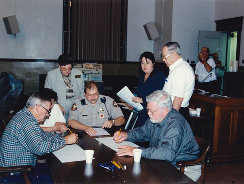 Blake Collins, Mary McDonald, Evelyn Panter, Winfred Cruse, Jammia Duvall, George Earley and Bill McDonald are shown, from left, working on an election day in Fannin County.