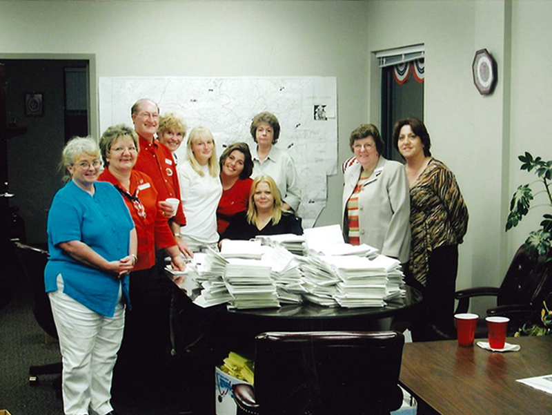 Fannin County Board of Elections staff are shown with a pile of voting related papers in 2004, the year of the big roll out of the touch screen voting units. Shown, from left, are Susan Byrum, Mary Ann Conner, Morris Queen, Lena Earley, Samantha Hill, Rachel Gray, Dorothy Davis, Cheryl Burns, Evelyn Panter and Jammia Duvall.