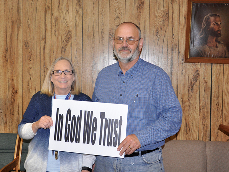Jan and Stewart Strickland hold a message from Appalachian Judicial Circuit District Attorney Alison Sosebee. The message is meant to provide a sense of hope to the community during these times.