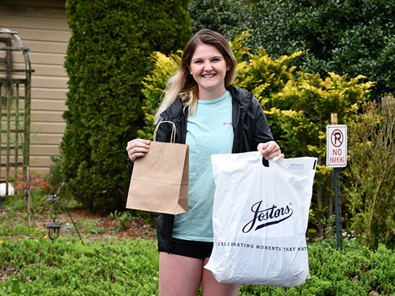 Fannin County High School senior Shelby Postell picked up her graduation gear and community-gifted gift cards and certificates from Cucina Rustica Friday, April 24.