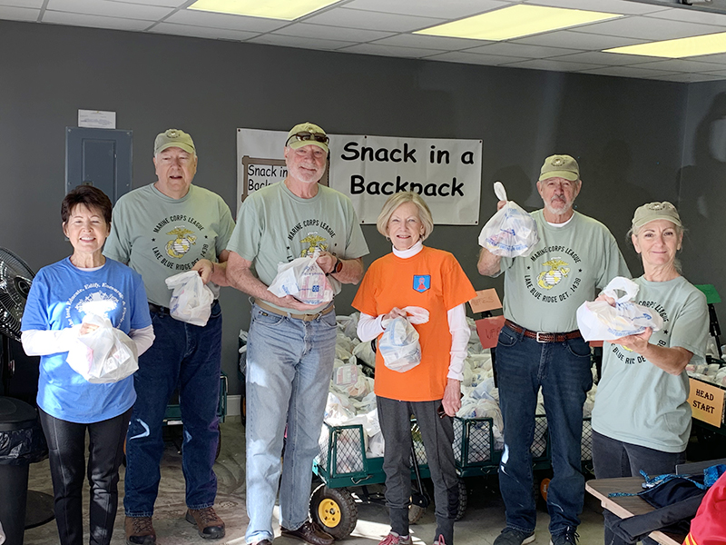 Members of the Marine Corps League Lake Blue Ridge Detachment 1438 assisted Snack in a Backpack by delivering 600 meals to three Fannin County elementary schools for distribution Thursday, April 2. Shown are, from left, Gail O’Neil, Marine Jeff O’Neil, Marine Dale Greene, Toots Greene, Marine Chuck Clark and Marine Dee Leuthe.