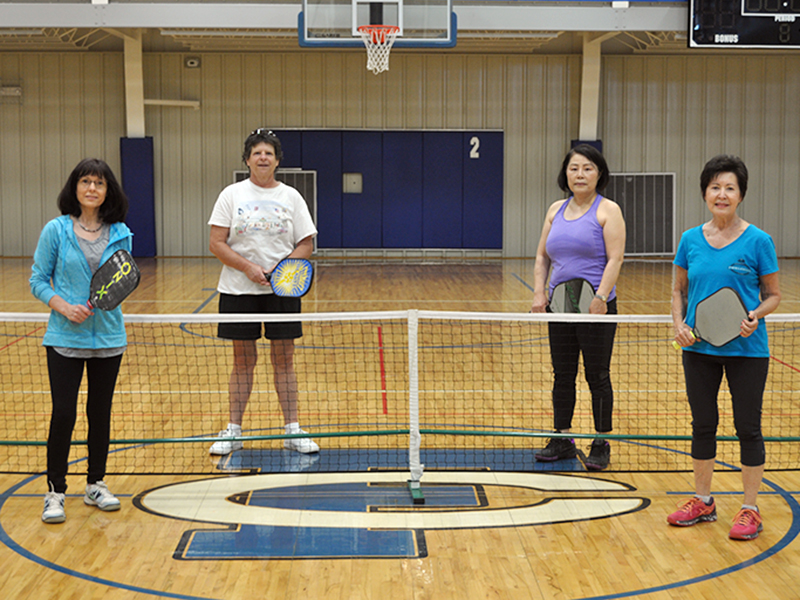 Pickleball players from left, Lynden Willits, Lori Schaltz, Kim Curry and Gail O’Neal take a break from playing pickleball for a photo at the Fannin County Recreation Center Thursday, May 7.