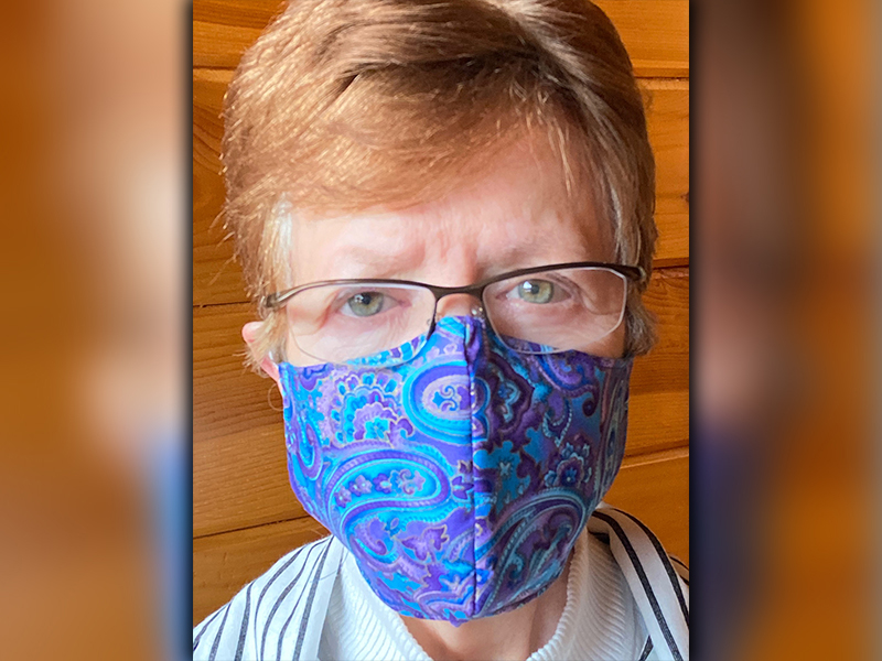 Donna Moriarty shows off her craft in a selfie. Moriarty has created around 300 masks to donate to folks without protection.