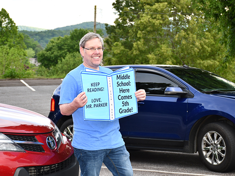 Blue Ridge Elementary School Media Specialist Ben Parker encourages fifth grade graduates to keep reading during the school’s Fifth Grade Drive-Thru Parade Tuesday, May 19.
