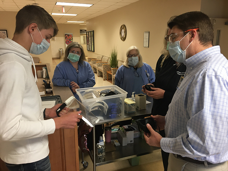 Fannin County High School student Bryce Ware discusses the Personal Protective Equipment he created with, from left, sleep technologists Holly Lowery and Debbie Sanders, Fannin Regional Executive Director of Nursing Stephanie Monico and Fannin Regional Chief Executive Officer Jason Jones.