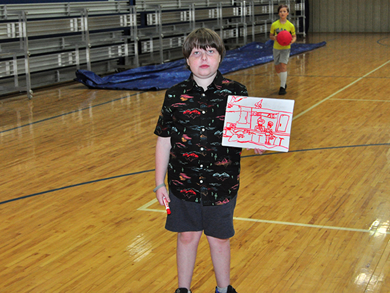 Joseph Love shows off a  drawing he drew during the Fannin County Recreation Department’s Summer Camp Wednesday, June 3.