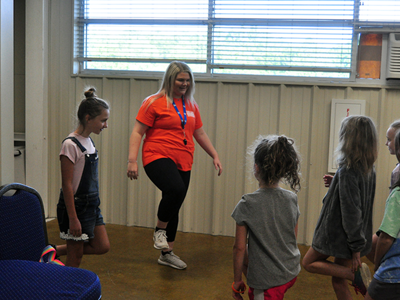 Summer Camp helper Chloe Clemmons, center, and helper Alania Hughes, left, lead a group in the game Simond Says during the Fannin County Recreation Department’s Summer Camp Wednesday, June 3.