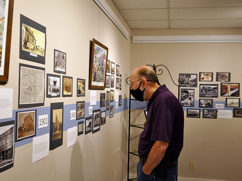 Mark Man checks out some old photographs of Fannin County during the opening of the Crossroads: Change in Rural America exhibition.
