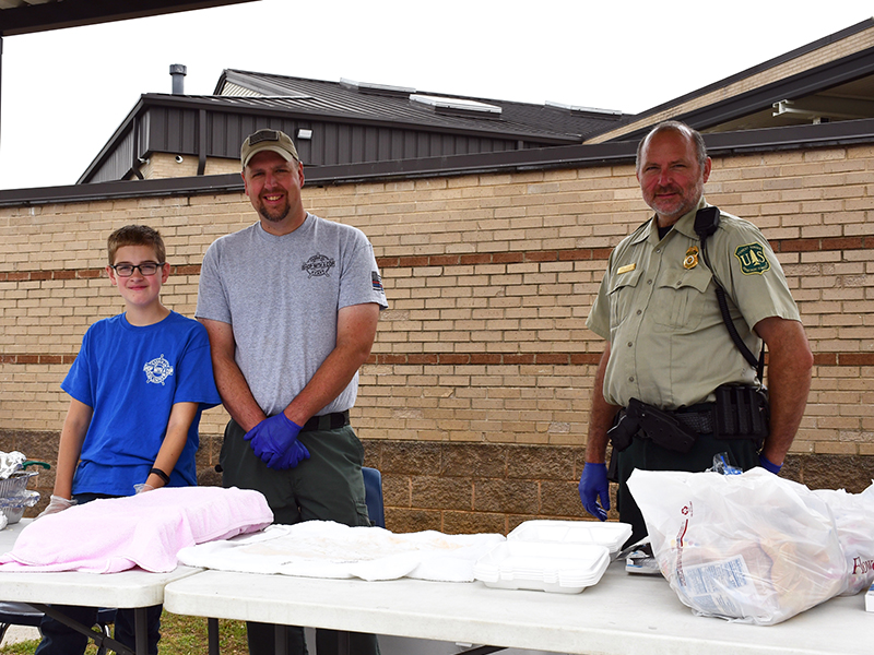 The 2020 Riding the Ridge event, held Saturday, June 27, helped raise money for the Fannin County Sheriff’s Office’s annual Shop with a Cop event. Volunteers shown are, from left, James Burrell, School Resource Officer Jim Burrell and U.S. Forest Service Officer Mike Tipton.