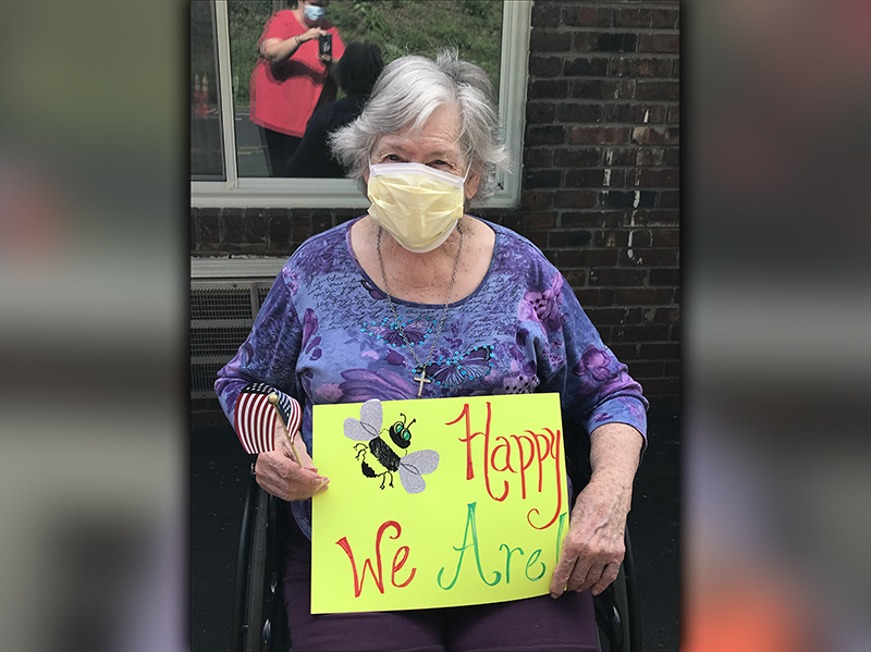 PruittHealth - Blue Ridge resident Betty Odom let her loved ones know that she and her fellow residents are happy during the center’s socially distanced drive-thru parade.