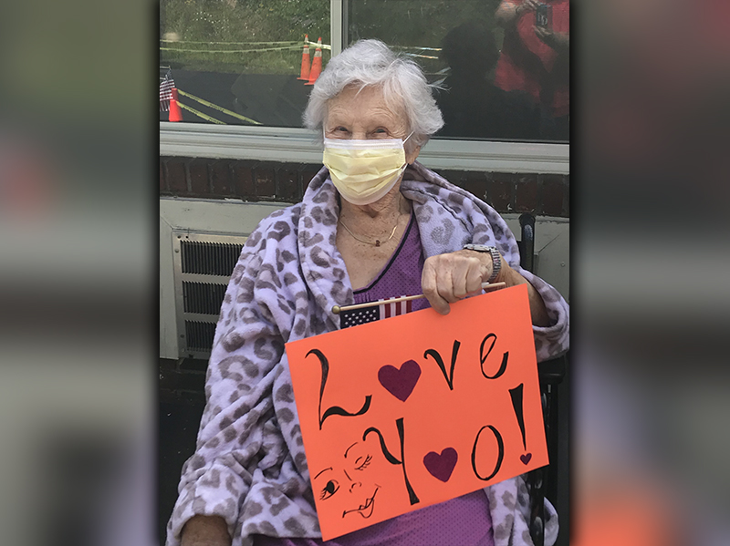 PruittHealth - Blue Ridge resident Virginia McClure told her loved ones, “Love You!” during the center’s socially distanced drive-thru parade.