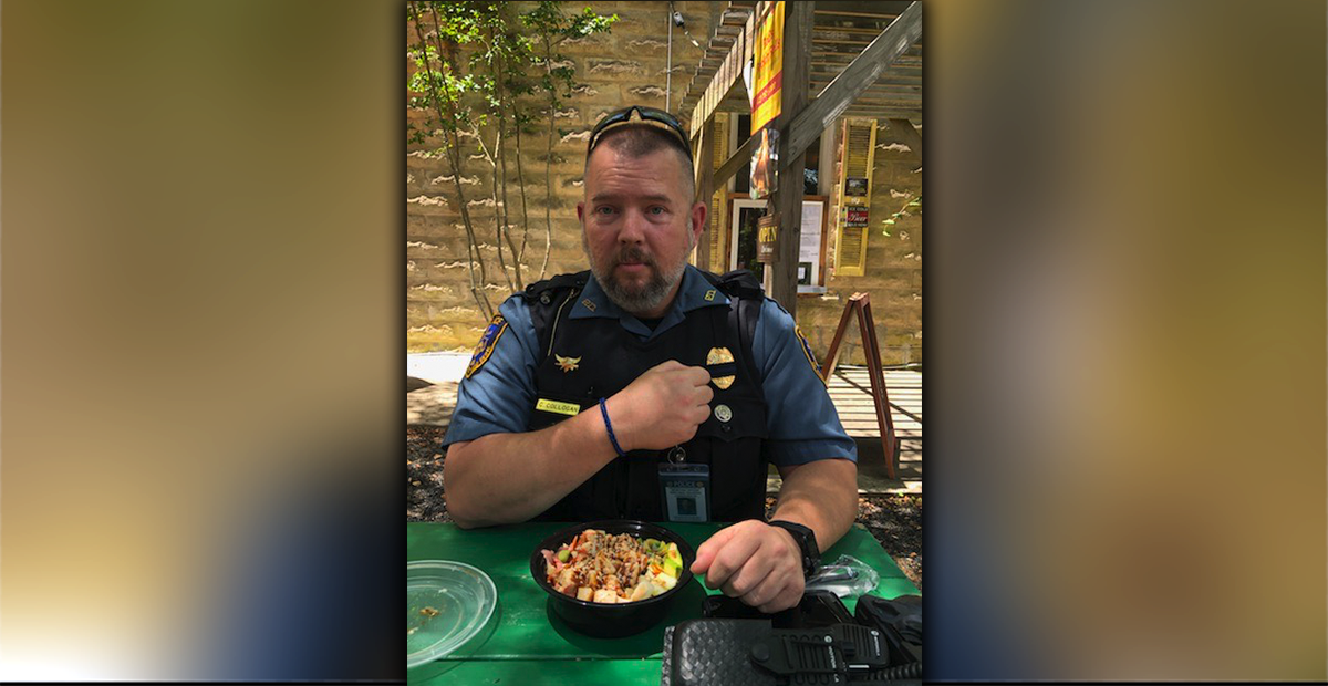 McCaysville Police Officer Cory Collogan shows off his Back the Blue bracelet made by Lacey Holloway as he prepares to eat a meal donated through the McCaysville youngster’s efforts to show appreciation to law enforcement officers.