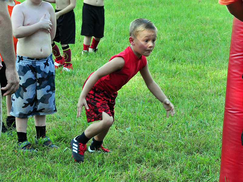 Cutler Curtis gets down in his three-point-stance during Copper Basin’s youth football conditioning Thursday, July 16.